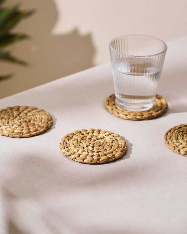 Set of 4 natural water hyacinth woven rattan coasters in warm beige