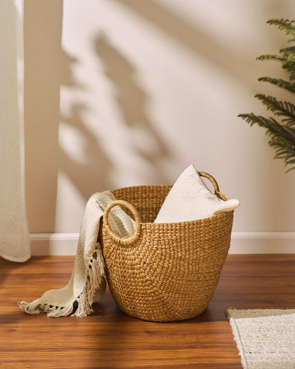 Medium water hyacinth storage basket in golden-brown seagrass with handles