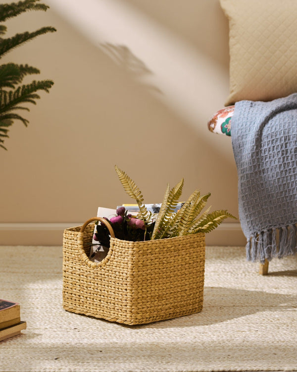 Medium Kauna grass storage basket in golden-brown weave with handle