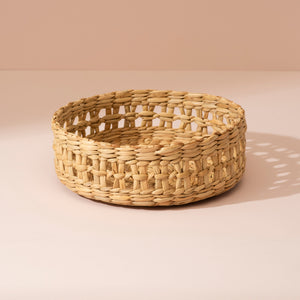 Small Kouna grass storage basket in beige seagrass with open lattice pattern