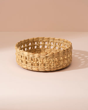 Small Kouna grass storage basket in beige seagrass with open lattice pattern