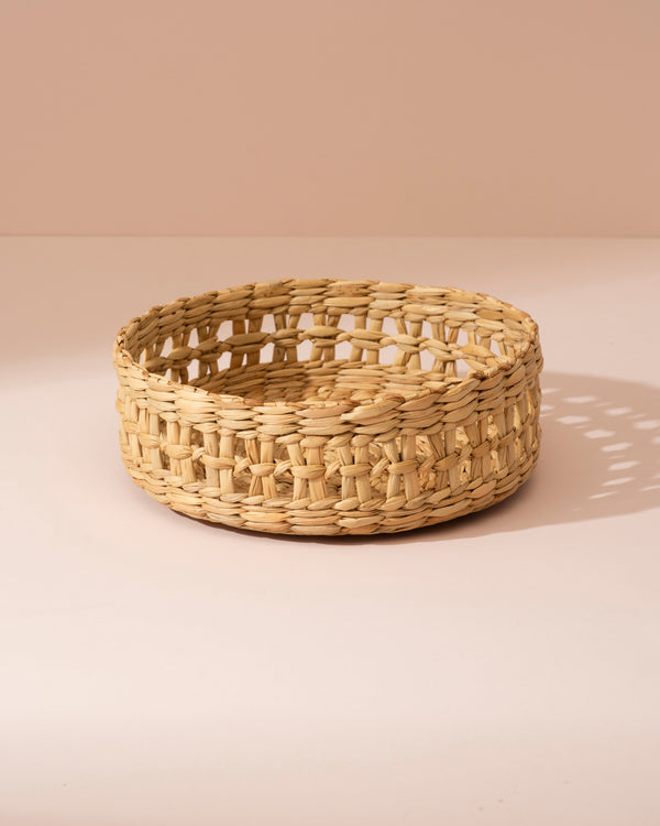 Small Kouna grass storage basket in beige seagrass with open lattice pattern