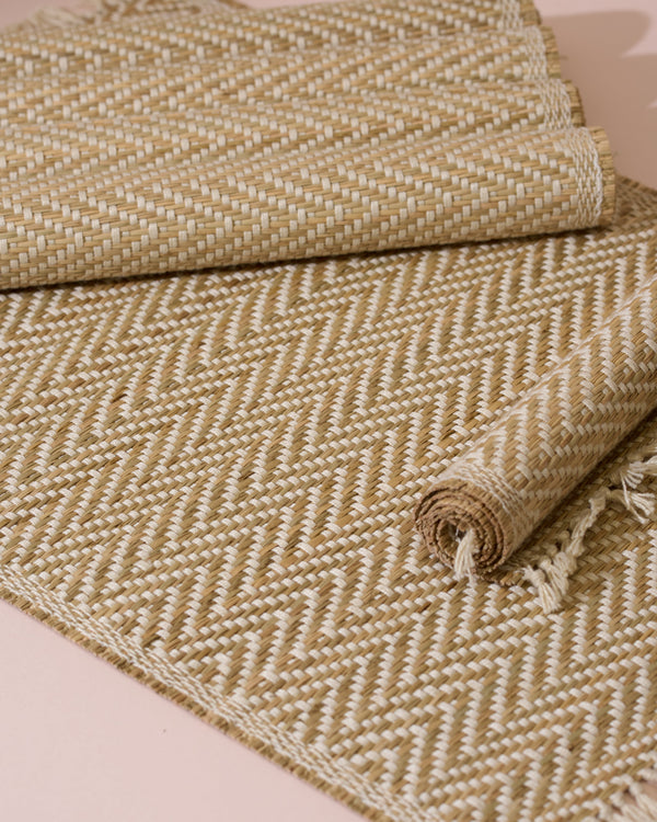 Beige and cream herringbone woven rug with fringed edges