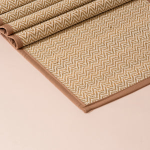 Light brown Madurkathi table runner with beige herringbone pattern and solid brown border, 152cm