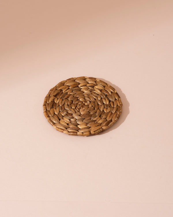 Set of 4 round water hyacinth coasters in brown seagrass spiral pattern