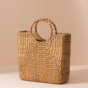 Beige water hyacinth tote with rounded wooden handle