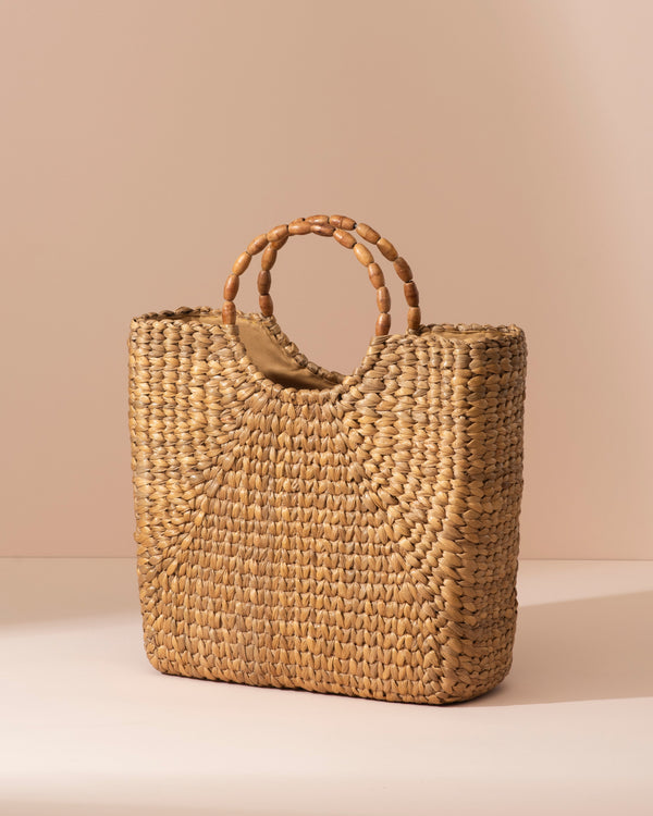Beige water hyacinth tote with rounded wooden handle