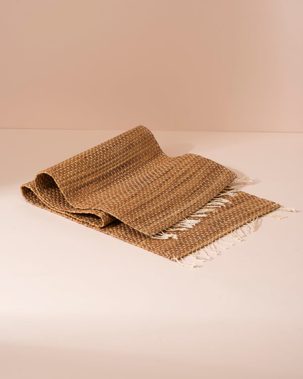 Beige woven jute throw blanket with white fringe, water hyacinth style 122cm